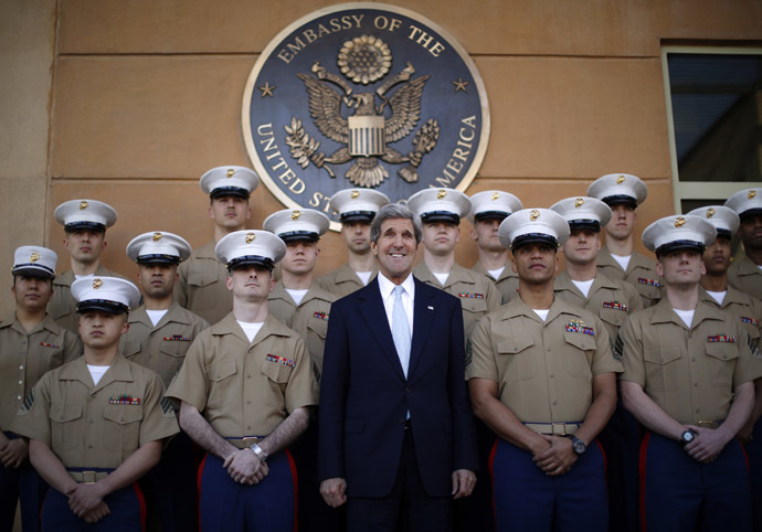 U.S. Secretary of State John Kerry (C) poses for a picture with U.S. Marines based in Baghdad during his visit to the U.S. Embassy in Baghdad March 24, 2013. (Reuters/Jason Reed)