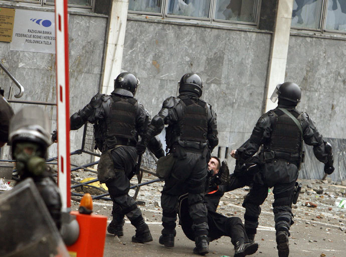 Police detain an anti-government protester in Tuzla February 6, 2014.(Reuters / Stringer)
