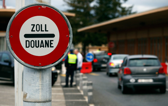 A sign is pictured at the Swiss French border with town of Ferney Voltaire in Le Grand-Saconnex near Geneva February 10, 2014. (Reuters / Denis Balibouse)
