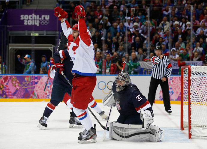 Russia's Alexander Radulov (L) celebrates a goal by teammate Pavel Datsyuk (not pictured) against Team USA's goalie Jonathan Quick, during the third period of their men's preliminary round ice hockey game at the Sochi 2014 Winter Olympic Games February 15, 2014 (Reuters / Jim Young)