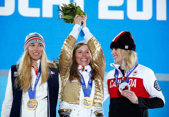Gold medallist Eva Samkova of the Czech Republic poses with silver medallist Canada's Dominique Maltais (R) and bronze medallist France's Chloe Trespeuch (L) during the victory ceremony for the women's snowboard cross competition at the 2014 Sochi Winter Olympics February 16, 2014 (Reuters / Eric Gaillard)