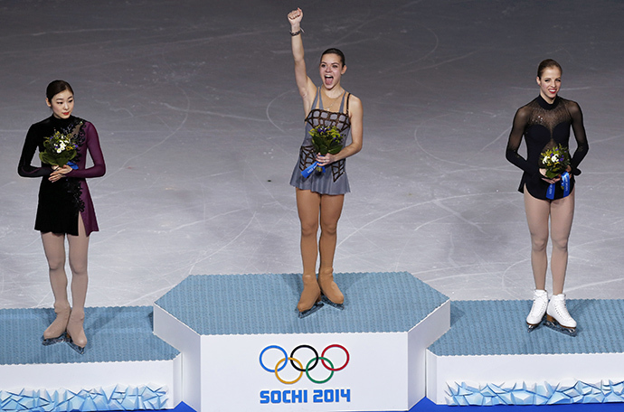 Russia's Adelina Sotnikova stands in first place, Korea's Yuna Kim stands in second place and Italy's Carolina Kostner stands in third place on the podium during the Figure Skating Women's free skating Program at the Sochi 2014 Winter Olympics, February 20, 2014. (Reuters / Issei Kato)