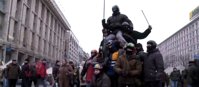 RT video still: Masked protesters in the center of Kiev.