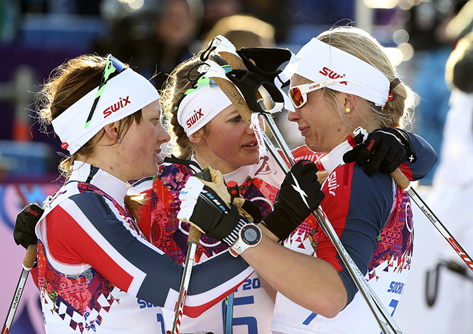 Winner Maiken Caspersen Falla (L) of Norway and her team mate, second placed Ingvild Flugstad Oestberg (C) comfort Astrid Uhrenholdt Jacobsen after competing in the women's cross-country sprint free final at the Sochi 2014 Winter Olympic Games in Rosa Khutor February 11, 2014. (Reuters / Sergei Karpukhin)
