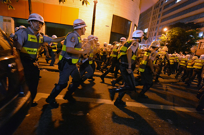Policemen are deployed during a protest against the government's expenditure for the 2014 FIFA World Cup in Sao Paulo, Brazil on February 22, 2014. (AFP Photo / Nelson Almeida)