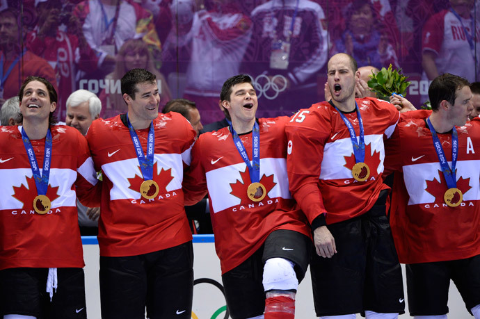 Canada's gold medallists players celebrate during the Men's Ice Hockey Medal Ceremony at the Bolshoy Ice Dome during the Sochi Winter Olympics on February 23, 2014. (AFP Photo / Jonathan Nackstrand)