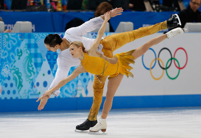 Russia's Tatiana Volosozhar and Russia's Maxim Trankov perform their Figure Skating Pairs Free Program at the Iceberg Skating Palace during the Sochi Winter Olympics on February 12, 2014. (AFP Photo / Adrian Dennis)