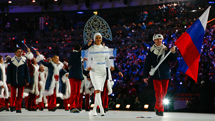Russia's flag-bearer Alexander Zubkov leads his country's contingent during the opening ceremony of the 2014 Sochi Winter Olympic Games at Fisht stadium February 7, 2014 (Reuters / Brian Snyder)