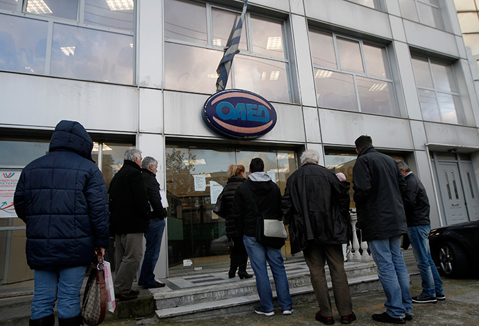 People wait outside a Greek Manpower Employment Organisation (OAED) office in an Athens suburb (Reuters / John Kolesidis)