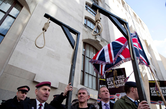 Replica hangman's gallows are seen during a protest outside the Old Bailey courthouse in London February 26, 2014. (Reuters / Neil Hall)