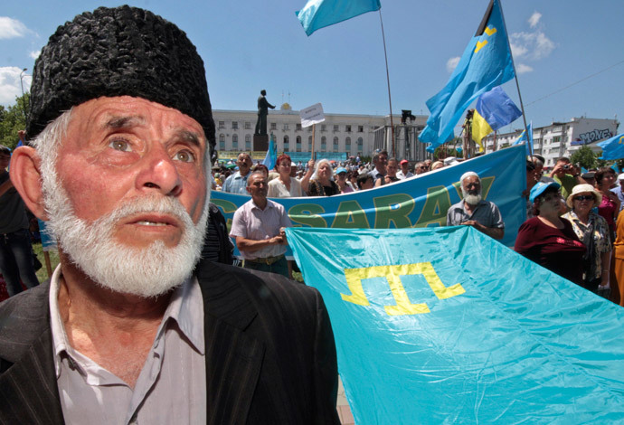 Crimean Tatars attend a ceremony marking the 68th anniversary of their mass deportation from the peninsula to distant parts of the Soviet Union in Simferopol May 18, 2012. (Reuters / Stringer)