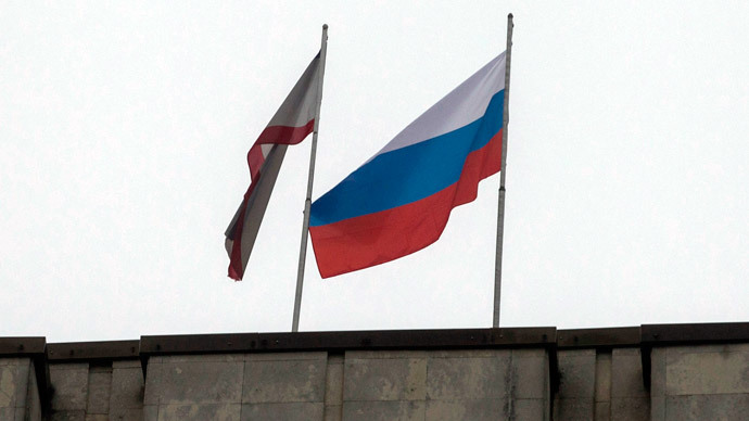 Russian flag over Crimea's parliament as people barricaded inside