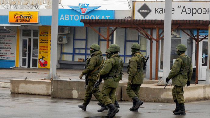 Armed 'self-defense squads' partially withdraw from Simferopol airport