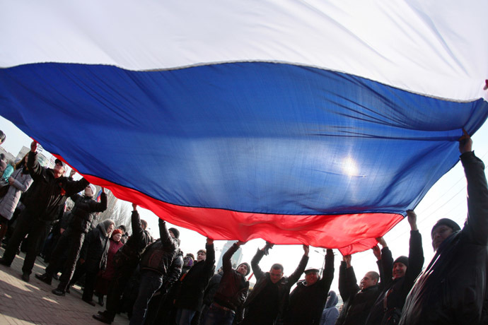 Pro-Russian protesters wave a Russian flag during a rally in the industrial Ukrainian city of Donetsk on March 1, 2014. (AFP Photo/Alexander Khudoteply)
