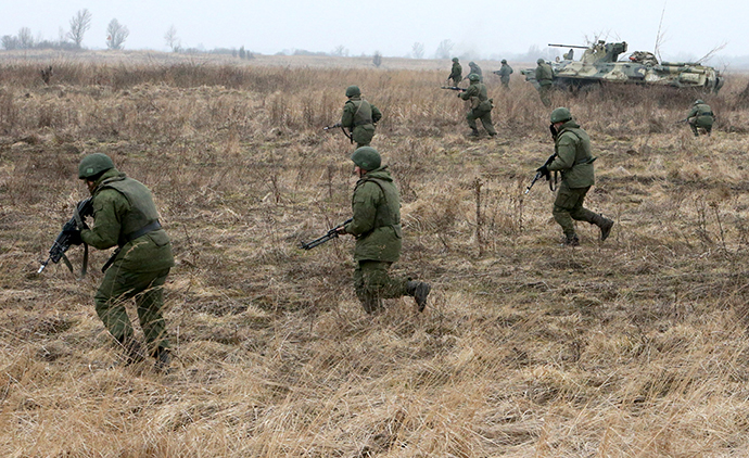 An attack of marines supported by combat vehicles during an exercise held by the Baltic Fleet coastal defense troops at the Pavenkovo training ground in the Kaliningrad region, March 2, 2014. (RIA Novosti / Igor Zarembo)