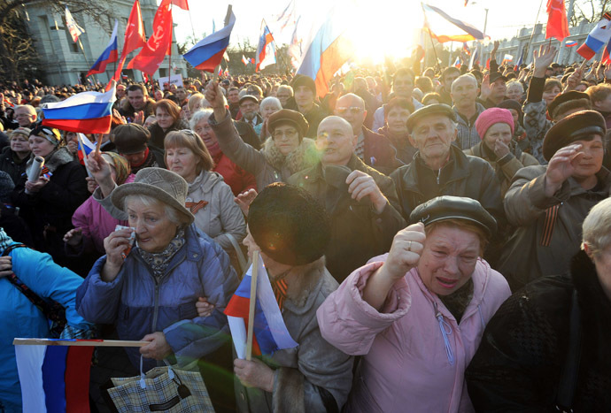 Pro-Russian activists holding Russian flags shout during their rally in the western Crimean city of Yevpatoria on March 5, 2014. (AFP Photo)