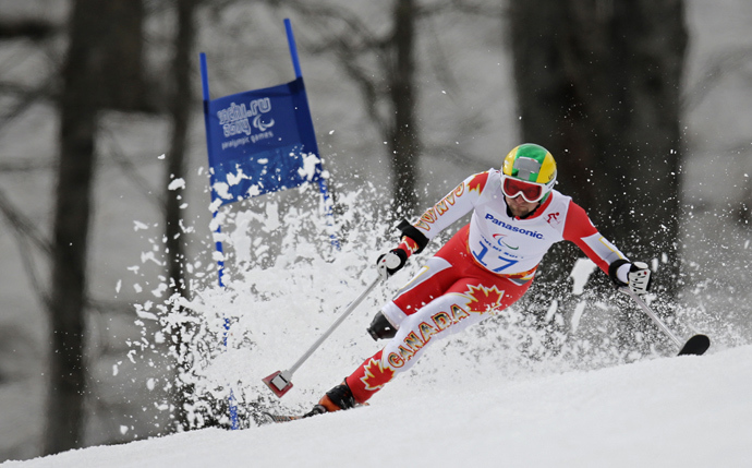 Canada's Matt Hallat skis during the men's standing skiing Super G at the 2014 Sochi Paralympic Winter Games at the Rosa Khutor Alpine Center March 9, 2014 (Reuters / Christian Hartmann)