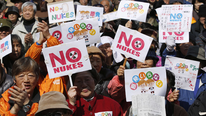 Anti-nuclear protesters hold banners saying "No Nukes" before they march in Tokyo March 9, 2014.(Reuters / Yuya Shino)