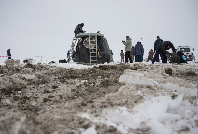 The Soyuz TMA-10M capsule is seen shortly after it landed with former ISS commander Oleg Kotov and flight engineers Sergei Ryazansky and Michael Hopkins from NASA onboard in a remote area southeast of the town of Zhezkazgan in central Kazakhstan, March 11, 2014. (Reuters / Bill Ingalls / NASA / Handout via Reuters)