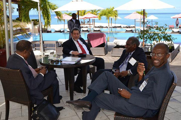 CARICOM Chairman Ralph Gonsalves (second left), with two of the Action Plan's backers, (r) Professor Andrew Downes and Professor Vaughan Lewis, and Sir Edwin Carrington Trinidad and Tobago's Ambassador to CARICOM. (Photo from facebook.com/cc.secretariat)