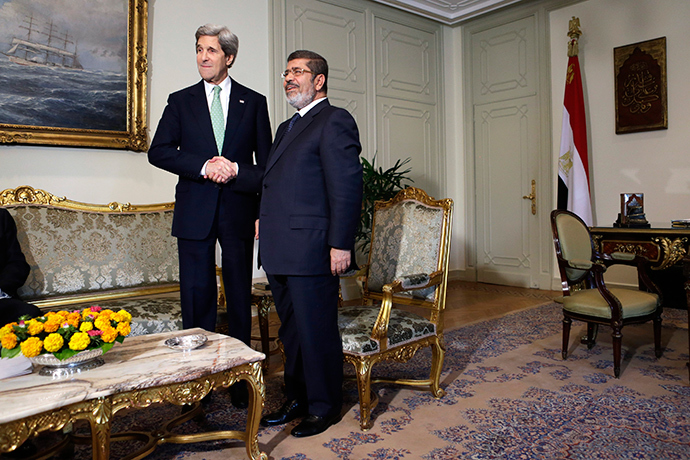 U.S. Secretary of State John Kerry (L) shakes hands with Egypt's President Mohamed Morsi (Reuters / Jacquelyn Martin)