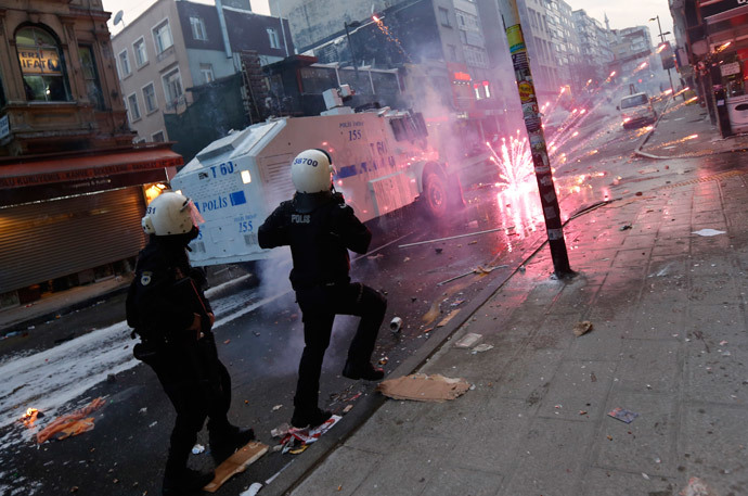 Fireworks thrown by anti-government protesters explode near riot policemen during a demonstration in Istanbul March 12, 2014. (Reuters / Murad Sezer )