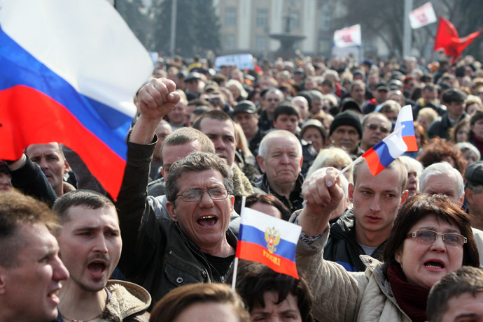 Pro-Russian activists hold Russian national flags during a demonstration rally in the center of the eastern Ukrainian city of Donetsk on March 15, 2014. (AFP Photo)