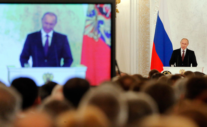 Russian President Vladimir Putin addresses the Federal Assembly, including State Duma deputies, members of the Federation Council, regional governors and civil society representatives, at the Kremlin in Moscow March 18, 2014. (Reuters / Maxim Shemetov)