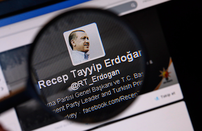 An image of Turkish Prime Minister Tayyip Erdogan on a twitter account is pictured through a magnifying glass in this illustration picture taken in Istanbul March 21, 2014 (Reuters / Murad Sezer)