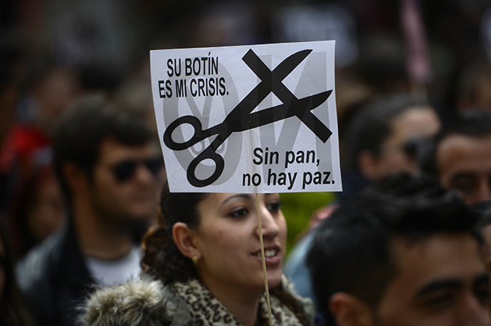 Students demonstrate in the streets of Madrid on March 27, 2014 marking the second day of strikes against the government's cuts in education spending. (AFP Photo / Pierre-Philippe Marcou)