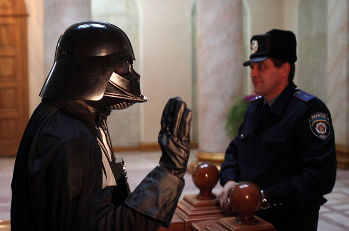 A Ukrainian wearing a Darth Vader costume speaks to a policeman in the city hall of the southern Ukrainian city of Odessa (AFP Photo)