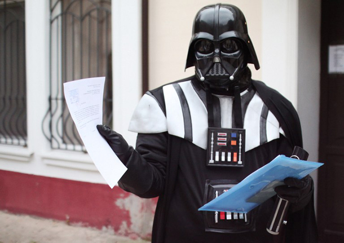 A Ukrainian wearing a Darth Vader costume shows papers outside the city hall of the southern Ukrainian city of Odessa (AFP Photo)