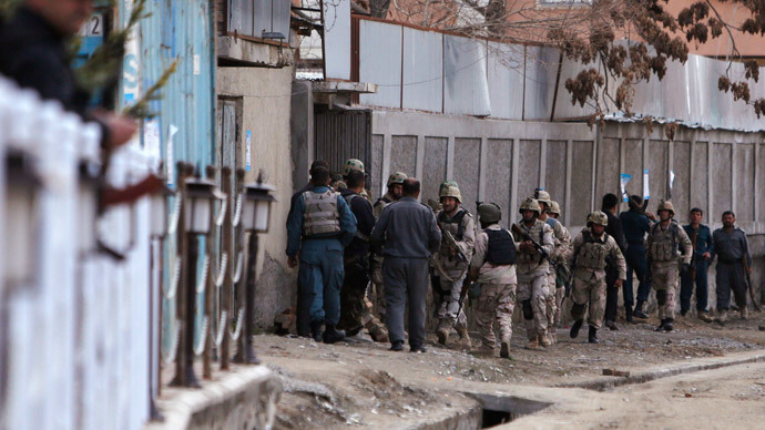 Afghan security personnel arrive at a guesthouse, the site of an attack, in Kabul March 28, 2014.(Reuters / Mohammad Ismail )