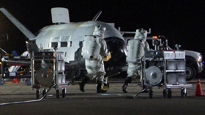 Technicians conduct post-landing operations on the X-37B Orbital Test Vehicle at Vandenberg Air Force Base, California in this U.S. Air Force handout photo dated December 3, 2010.(Reuters / U.S. Air Force)