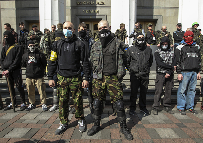 Members of the Ukrainian far-right radical group Right Sector stand outside the parliament in Kiev March 28, 2014. (Reuters / Valentyn Ogirenko)