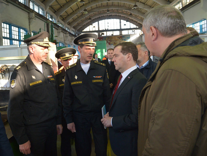 Russia's Prime Minister Dmitry Medvedev (2nd R) visits the 13th Ship-Repairing Yard of Russian Black Sea Fleet in Sevastopol, on March 31, 2014, with Russian deputy prime minister Dmitry Rogozin (R), who oversees the defence sector, accompanying Medvedev. (AFP Photo / Alexander Astafyev)