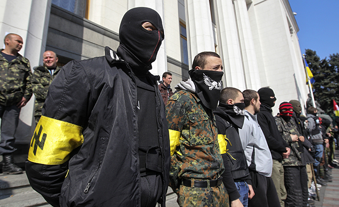 Members of the Ukrainian far-right radical group Right Sector stand outside the parliament in Kiev March 28, 2014. (Reuters / Valentyn Ogirenko)