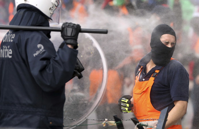 A demonstrator is sprayed by tear gas during a European trade union protest against austerity measures, in central Brussels April 4, 2014. (Reuters/Francois Lenoir)
