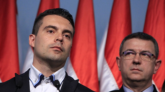 Gabor Vona, the chairman of the far-right Jobbik party, (L) reacts as he addresses to supporters after partial results of parliamentary elections are announced in Budapest April 6, 2014. (Reuters / Bernadett Szabo)