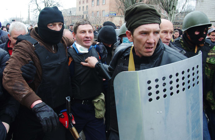 Anti-government militiamen detain the head of the regional police after storming the regional police building in the eastern Ukrainian city of Horlivka (Gorlovka), near Donetsk, on April 14, 2014. (AFP Photo / Alexey Kravtsov)