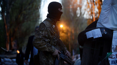 Airborne gunmen attack Ukrainian militia checkpoint near weapons depot