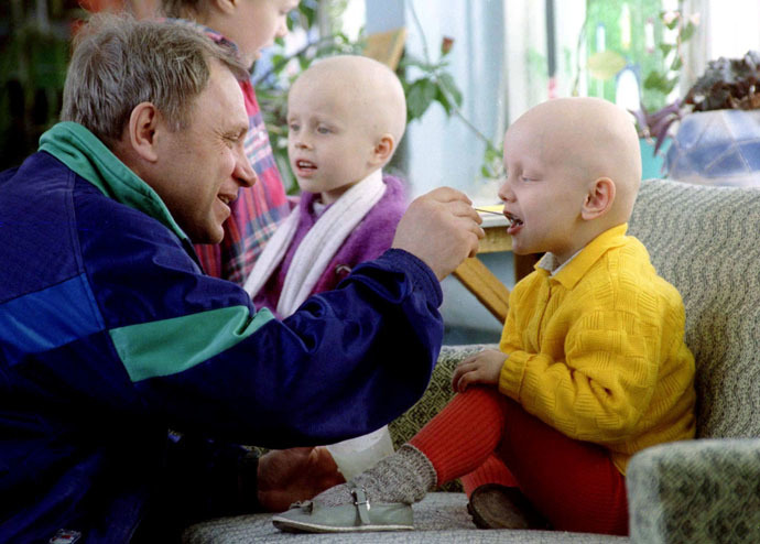A father feeds his child in the Belarus capital of Minsk special hospital, which deals with radiation related illnesses April 23, 1996. A small amount of radiation escaped at the Chernobyl nuclear power station on the eve of the 10th anniversary of the world's worst nuclear disaster it was reported April 25, 1996 (Reuters)