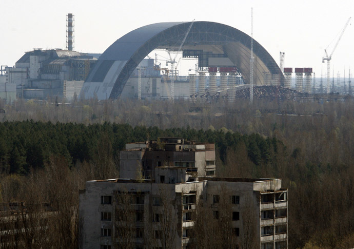 The first half of the Chernobyl New Safe Confinement, or NSC, an arch that which will cover the reactor building, is seen after it was pushed to its site at the Chernobyl Nuclear Power plant on April 3, 2014. (AFP Photo/Anatoly Stepanov)