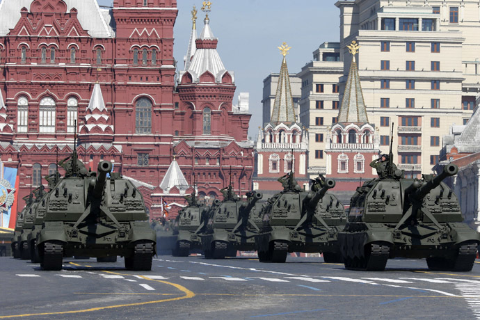 Russian servicemen onboard self-propelled artillery vehicles salute during the Victory Day Parade in Moscow's Red Square May 9, 2014. (Reuters)
