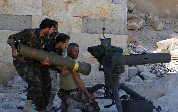 Rebel fighters prepare to launch an anti-tank missile towards forces loyal to Syria's President Bashar al-Assad in Maaret al-Naaman village, in Idlib April 30, 2014. (Reuters / Rasem Ghareeb)