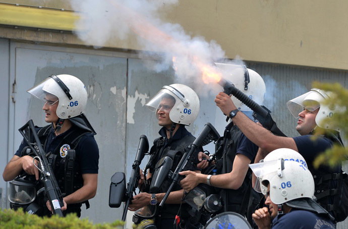 Riot police fire tear gas against protesters as they demonstrate to blame the ruling AK Party (AKP) government on the mining disaster in western Turkey, in Ankara May 14, 2014. (Reuters)