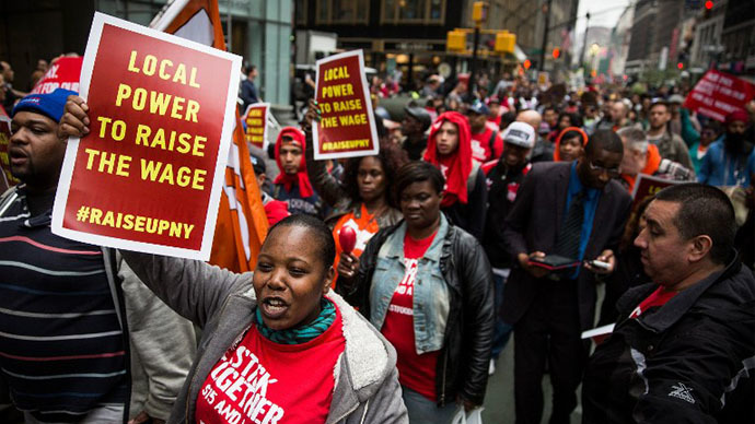 Protesters demanding higher wages for fast food workers chant during a massive rally on May 15, 2014 in New York City. (AFP Photo / Getty Images / Andrew Burton)