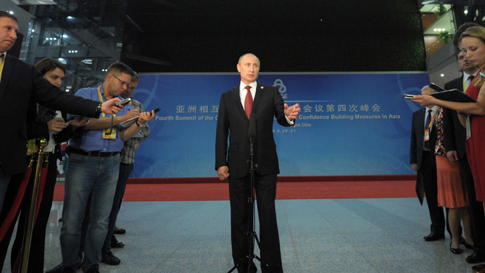 May 21, 2014. President Vladimir Putin talks to Russian journalists in Shanghai. (RIA Novosti/Alexei Druzhinin)