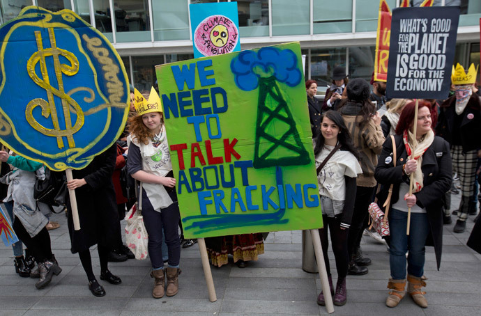 Demonstrators hold banners during an anti-fracking protest in central London March 19, 2014. (Reuters / Neil Hall)