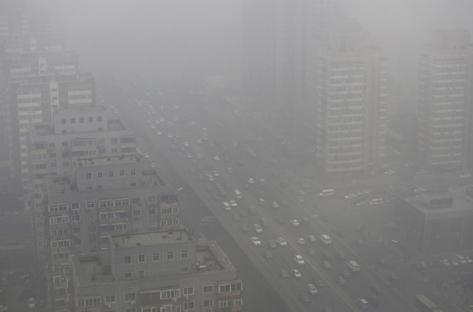 Cars drive on the Three Ring Road amid the heavy haze in Beijing February 26, 2014. (Reuters/Jason Lee)